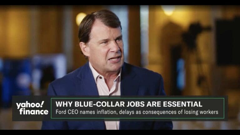 A man in a suit speaks in an interview on Yahoo Finance with the headline, "WHY BLUE-COLLAR JOBS ARE ESSENTIAL" and a subheading about the Ford CEO discussing the skilled trades crisis and worker shortages.